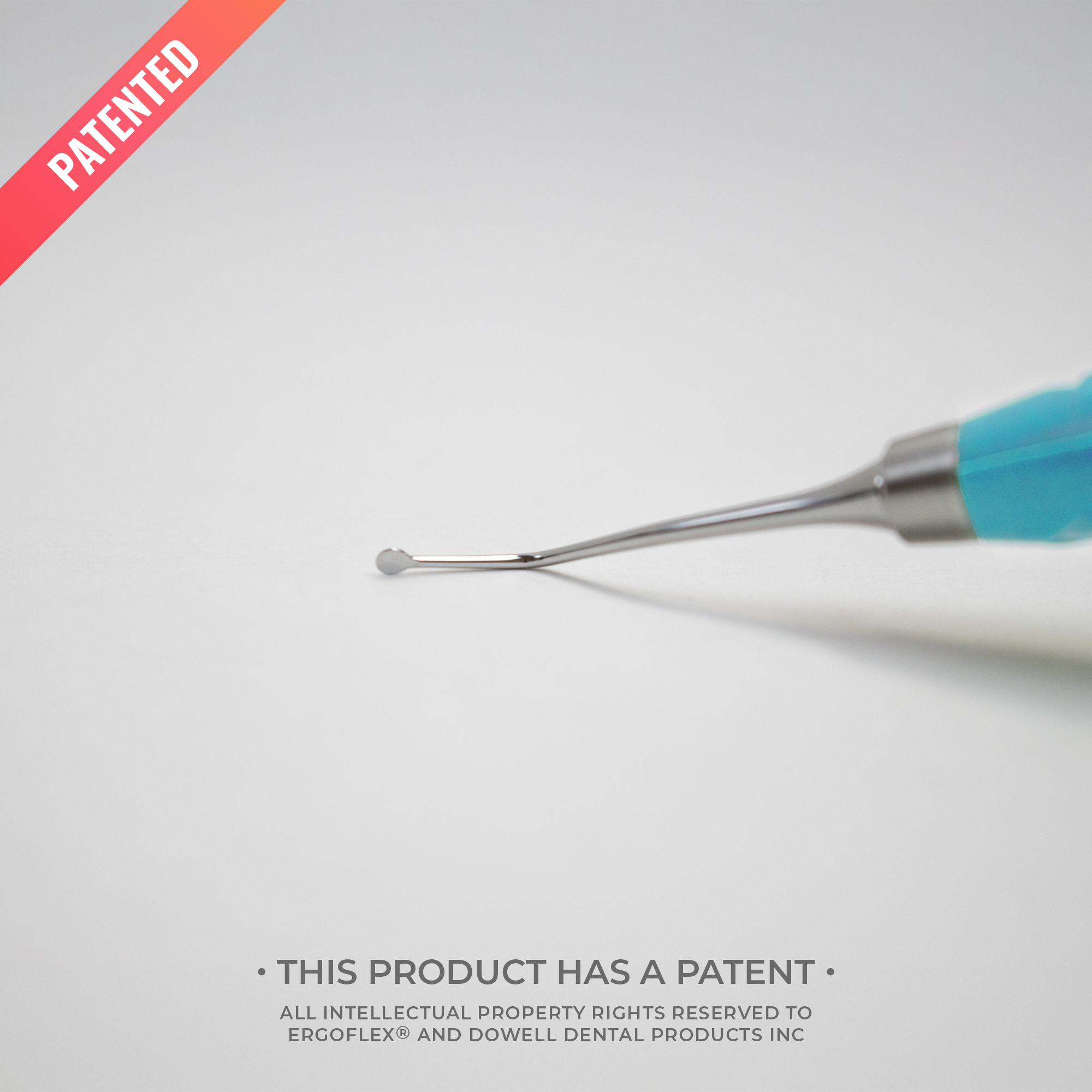 Dental tool with blue handle on a white background, featuring the word 'Patented'.
